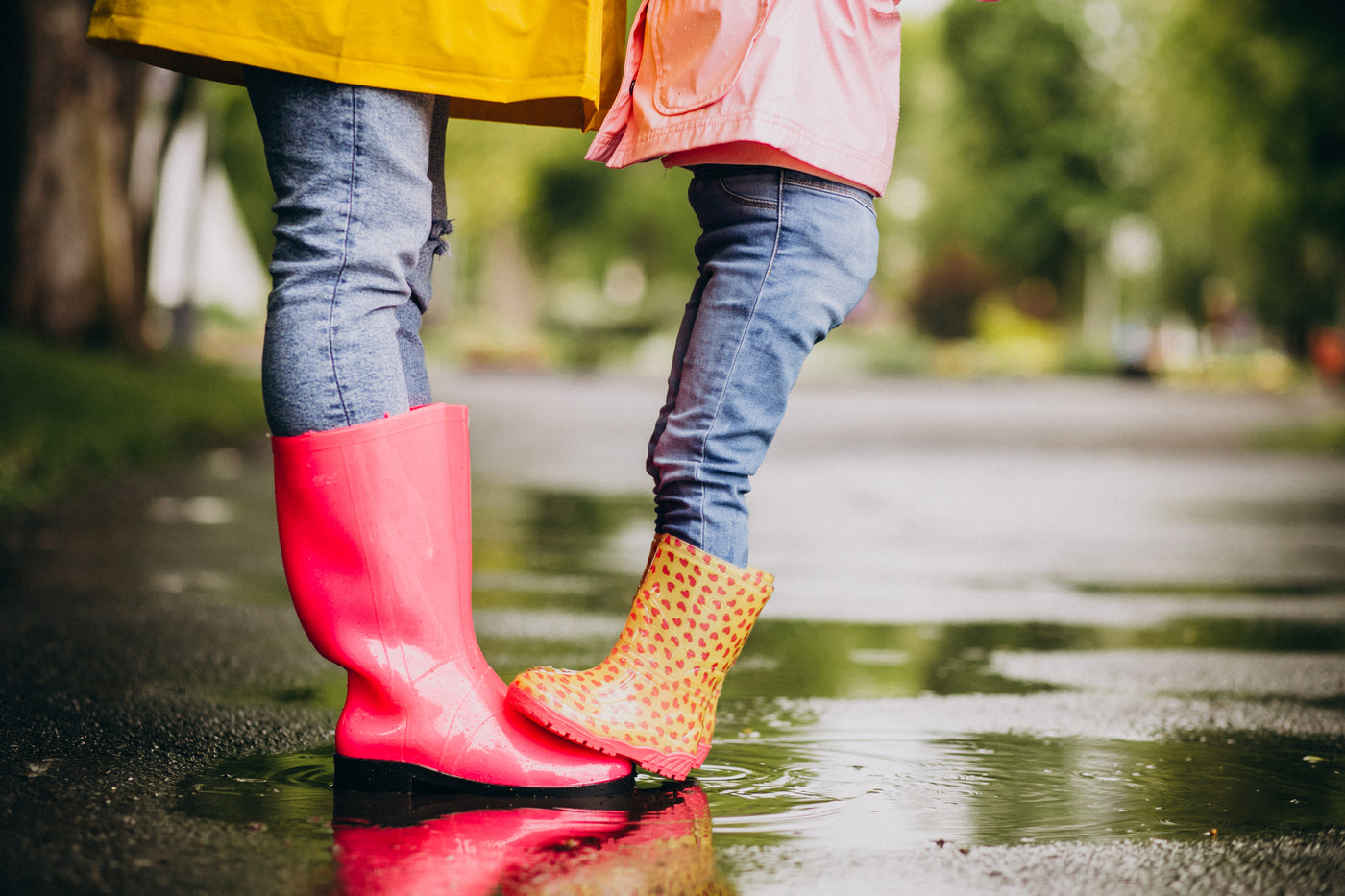 two-pair-rubber-boots-close-up-street