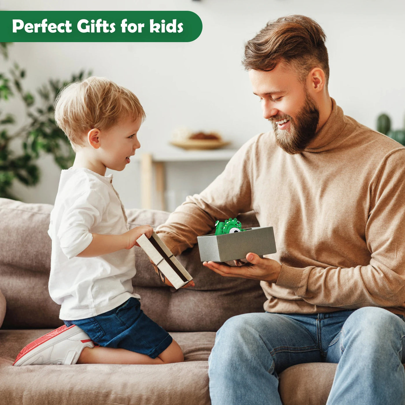 Father gifting kids digital camera to son